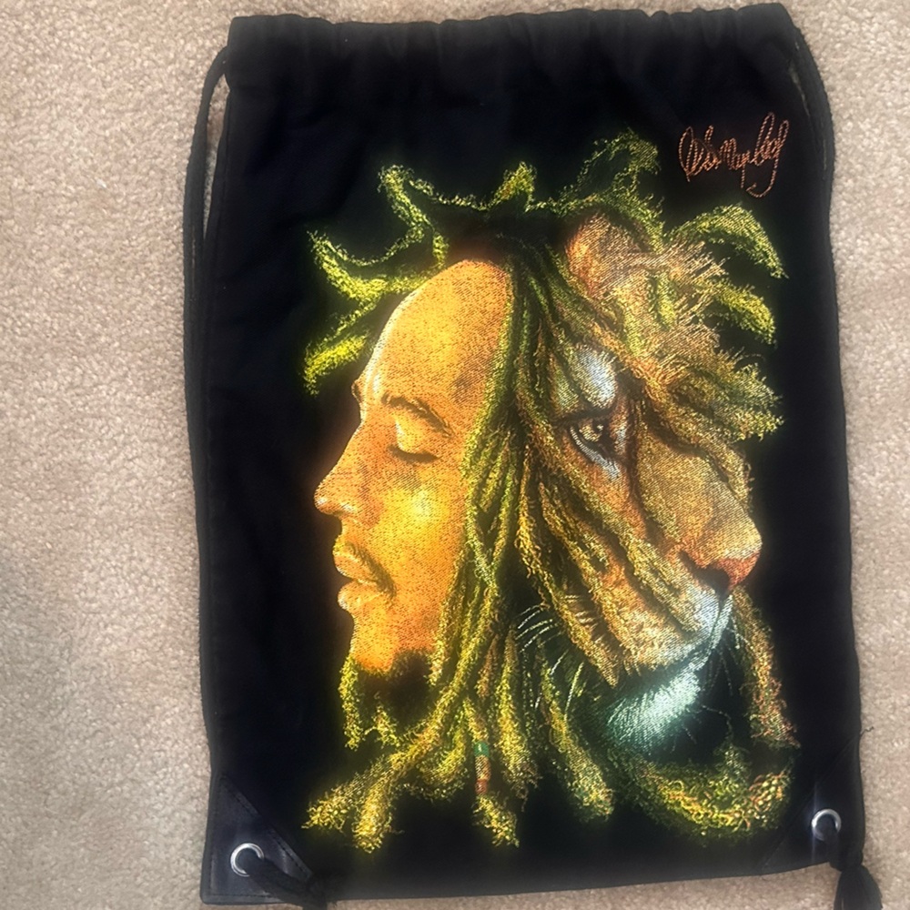 Black Drawstring Backpack With Embroidered Design - image 1